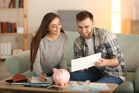 Young couple planning and budgeting their finances